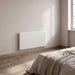 Radiatore elettrico Nobo Oslo Wi-Fi 1000W, installato in camera da letto